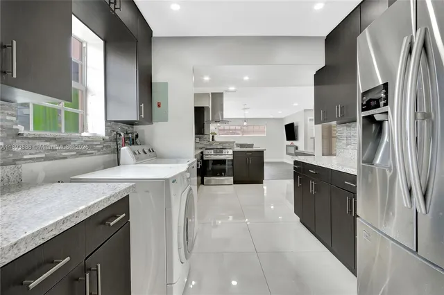 a view of a hallway with wooden floor and closet