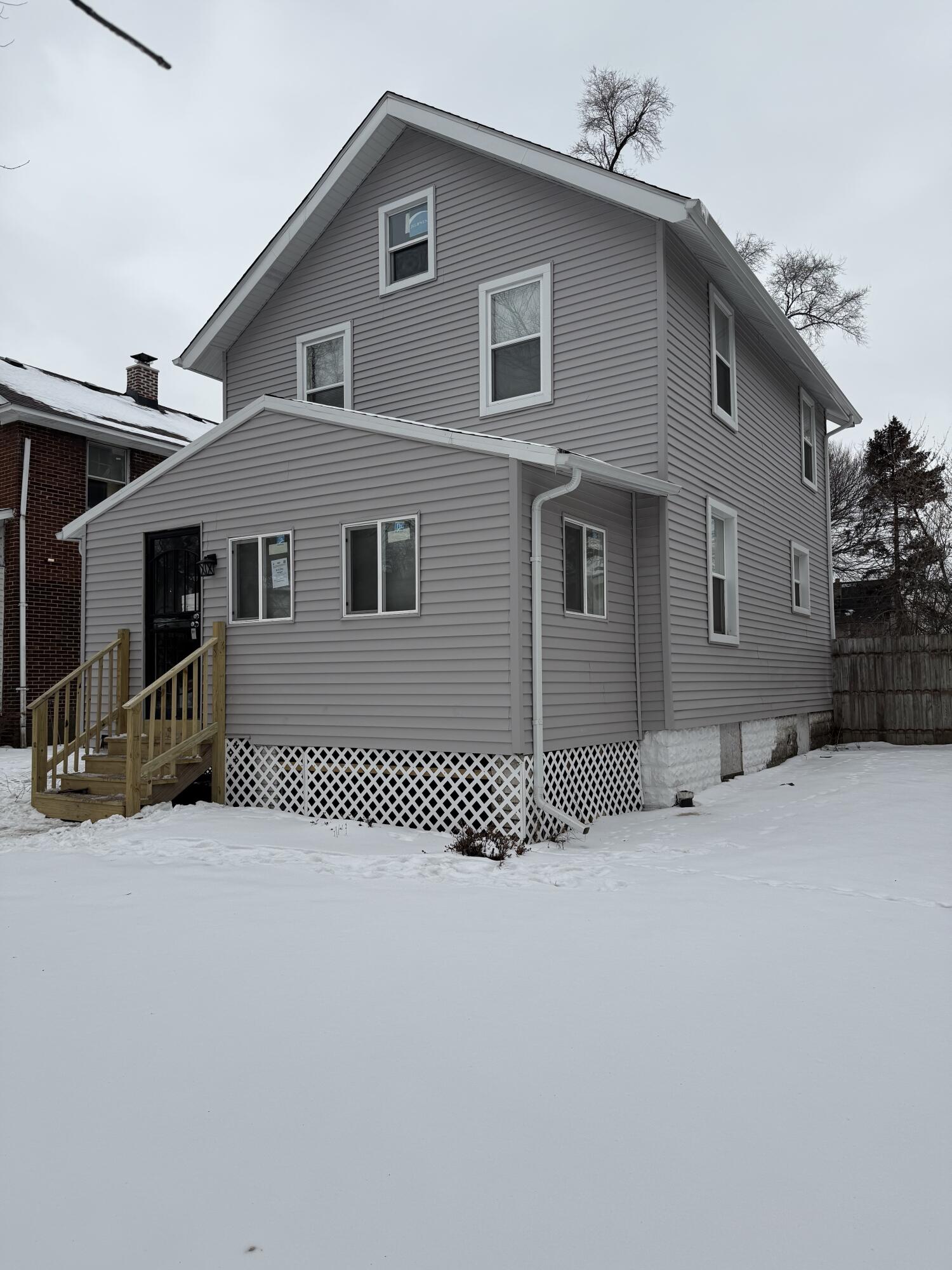 634 Kentucky Street Gary, IN 46402 - Photo 3 of 18 a front view of a house with a wooden fence