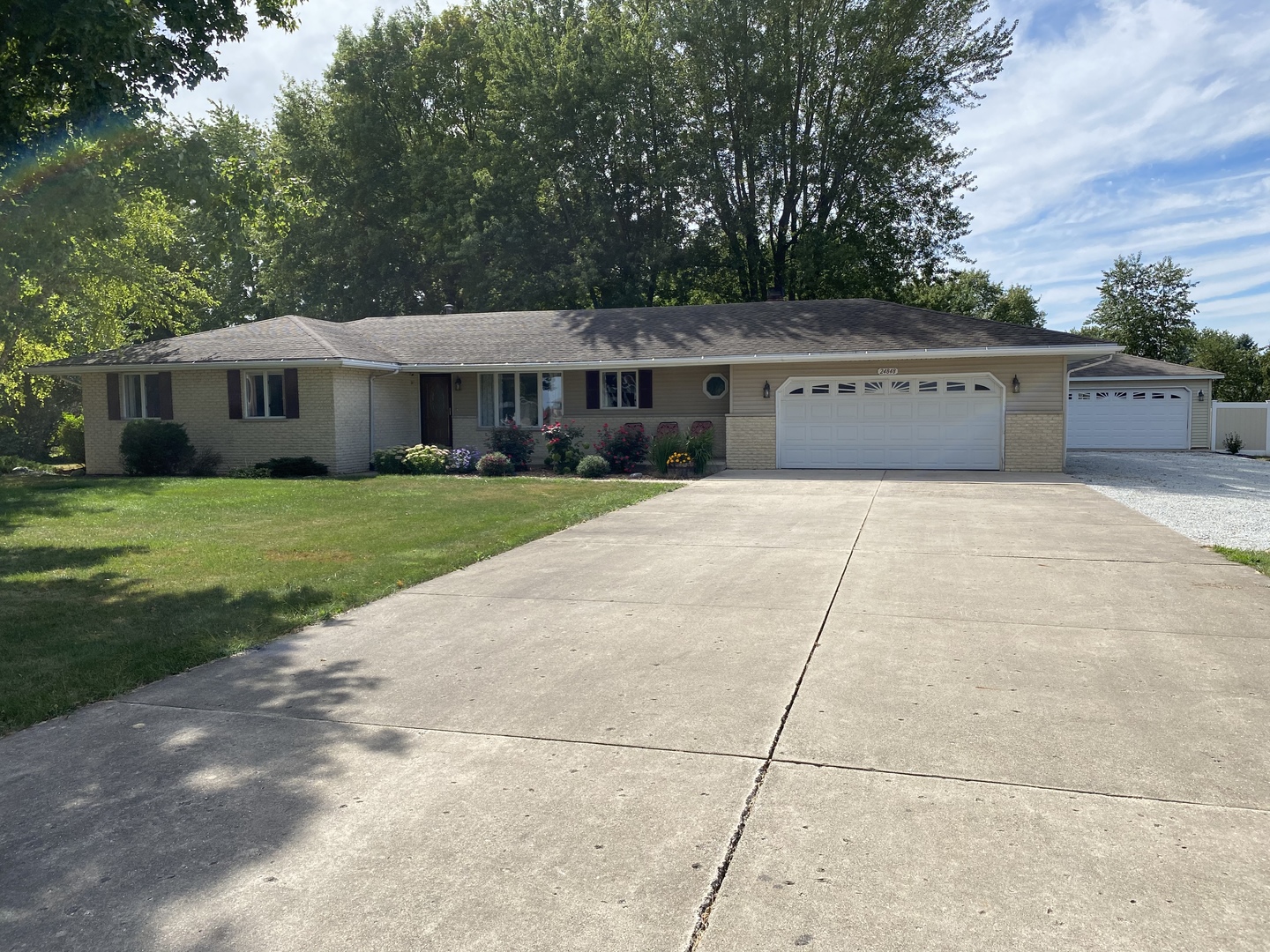 24848 South Ridge Road Elwood, IL 60421 - Photo 1 of 48 a front view of a house with a garden
