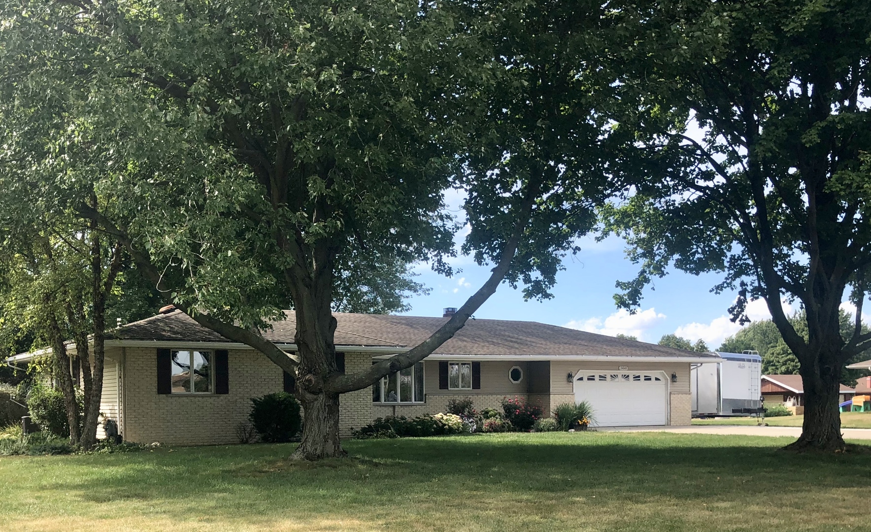 24848 South Ridge Road Elwood, IL 60421 - Photo 2 of 48 a front view of a house with a garden and trees