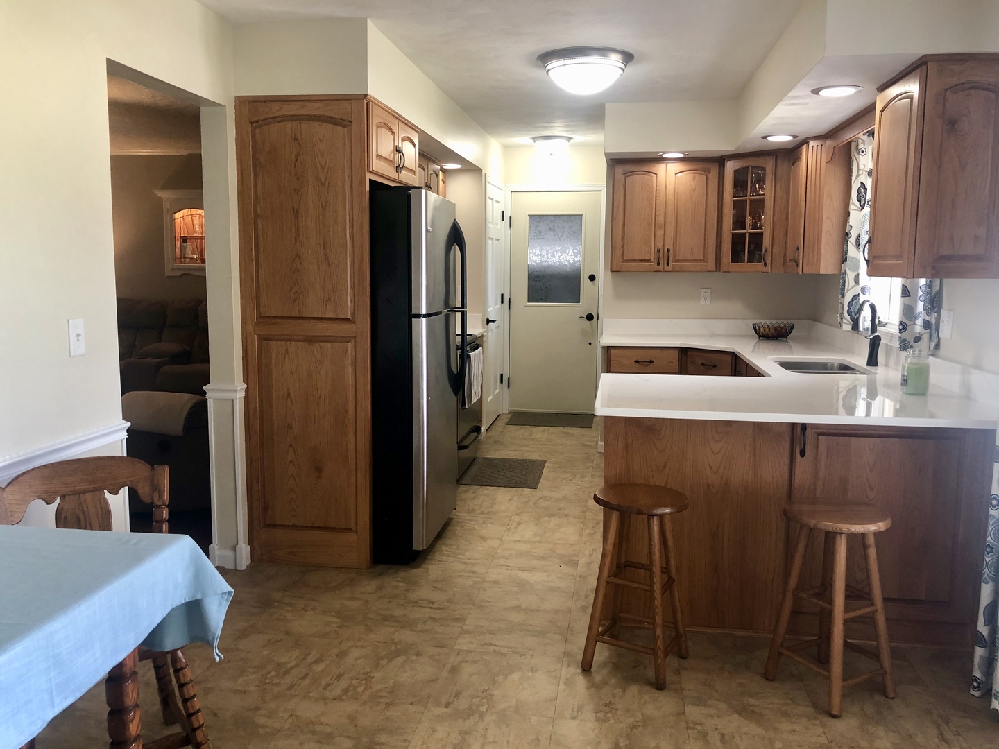 24848 South Ridge Road Elwood, IL 60421 - Photo 20 of 48 a kitchen with a table chairs refrigerator and microwave