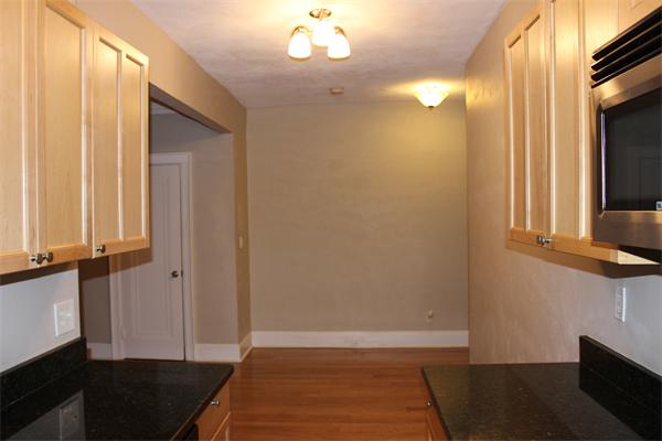 8 Chiswick Road, Unit 23 Boston, MA 02135 - Photo 5 of 15 a view of hallway with window and wooden floor