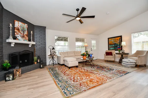a living room with furniture or couch and a fireplace