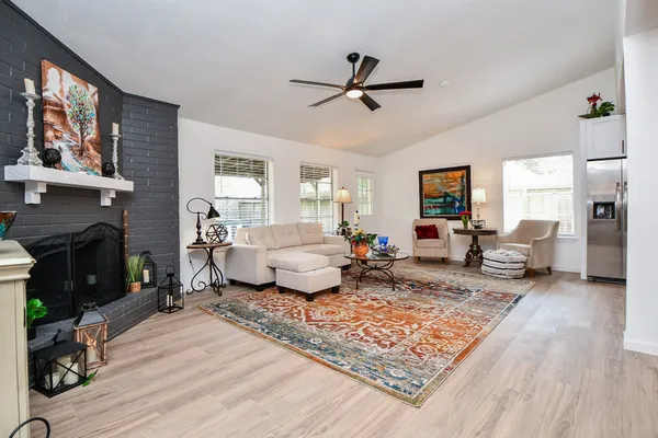 a living room with furniture and a fireplace