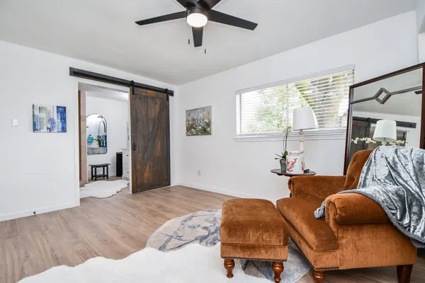 a bedroom with furniture and a window