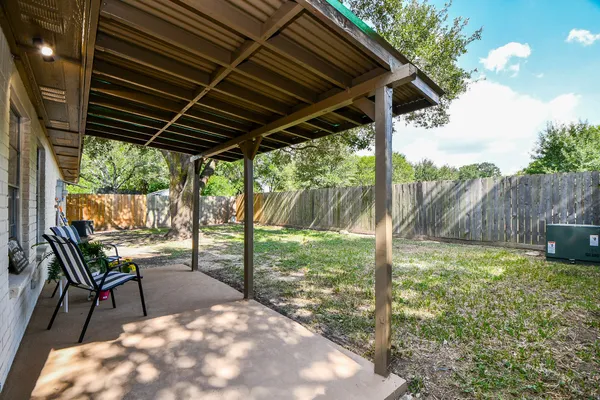 a view of backyard with green space