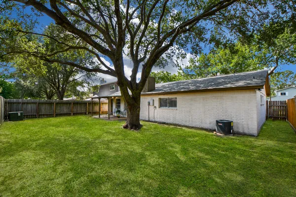 a backyard of a house with lots of green space