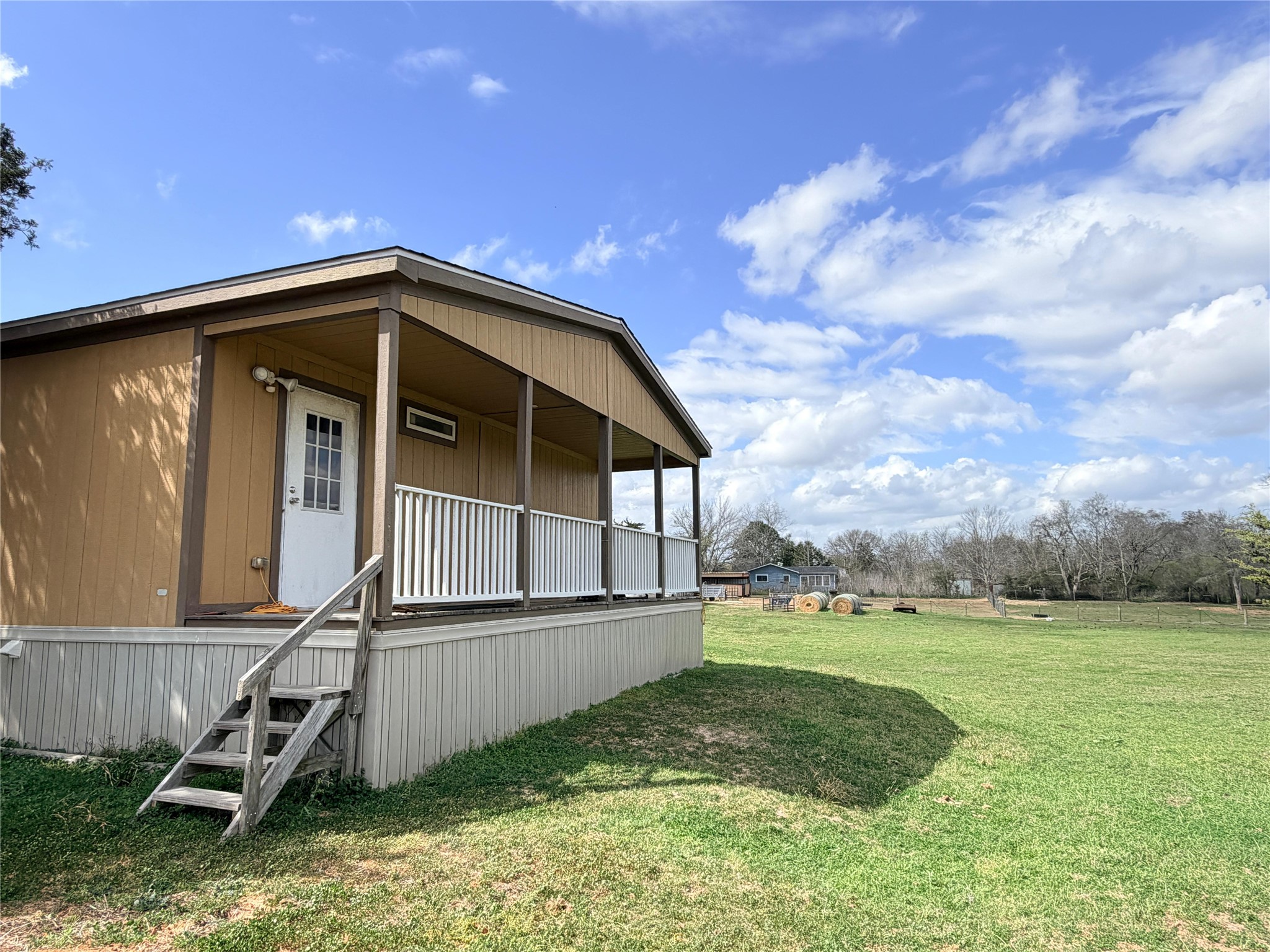 13700 Burnett Road Beasley, TX 77417 - Photo 18 of 38 a view of a tiny house with yard and entertaining space