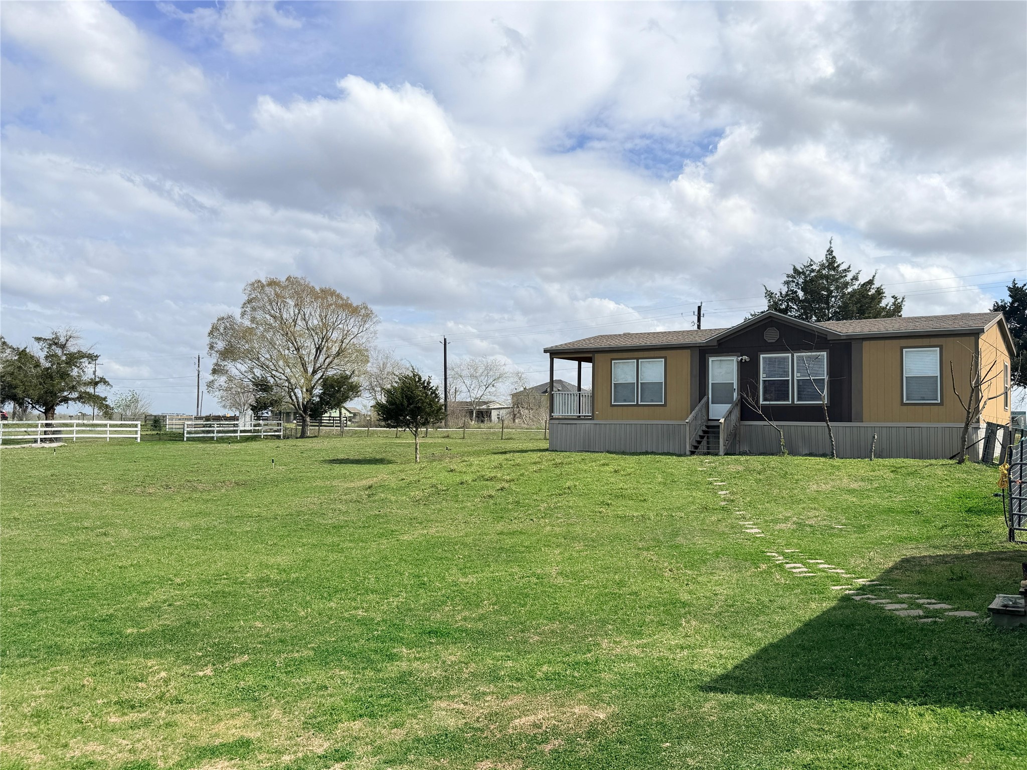 13700 Burnett Road Beasley, TX 77417 - Photo 19 of 38 a view of a yard in front of a house
