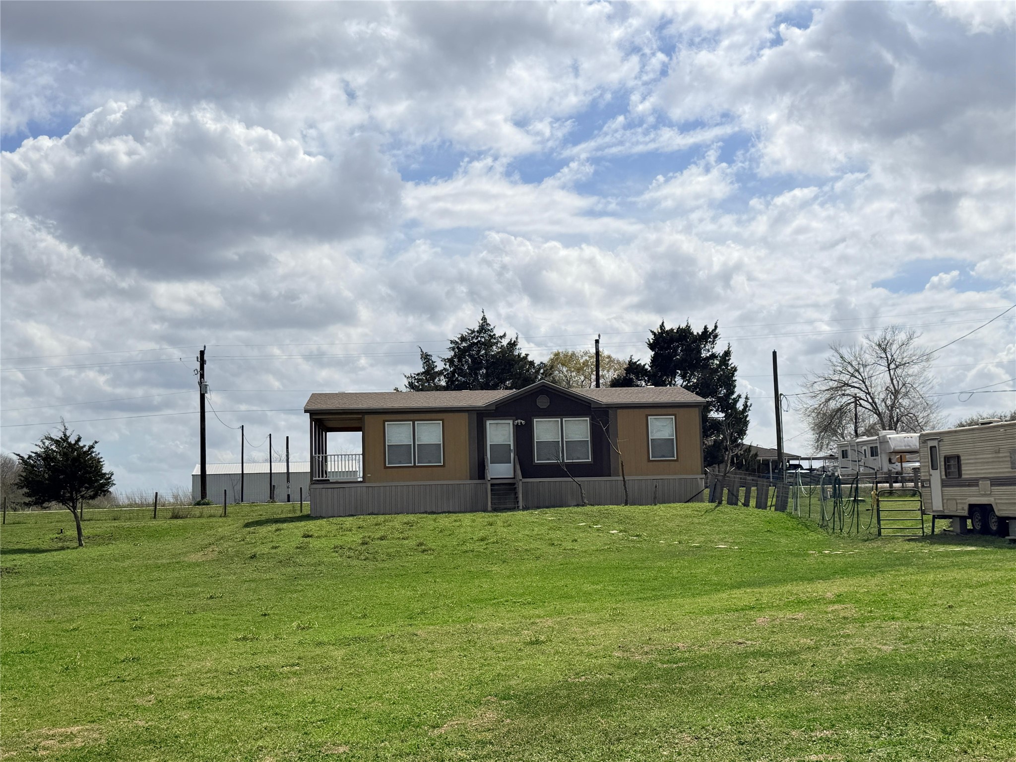 13700 Burnett Road Beasley, TX 77417 - Photo 2 of 38 a view of a house with a big yard