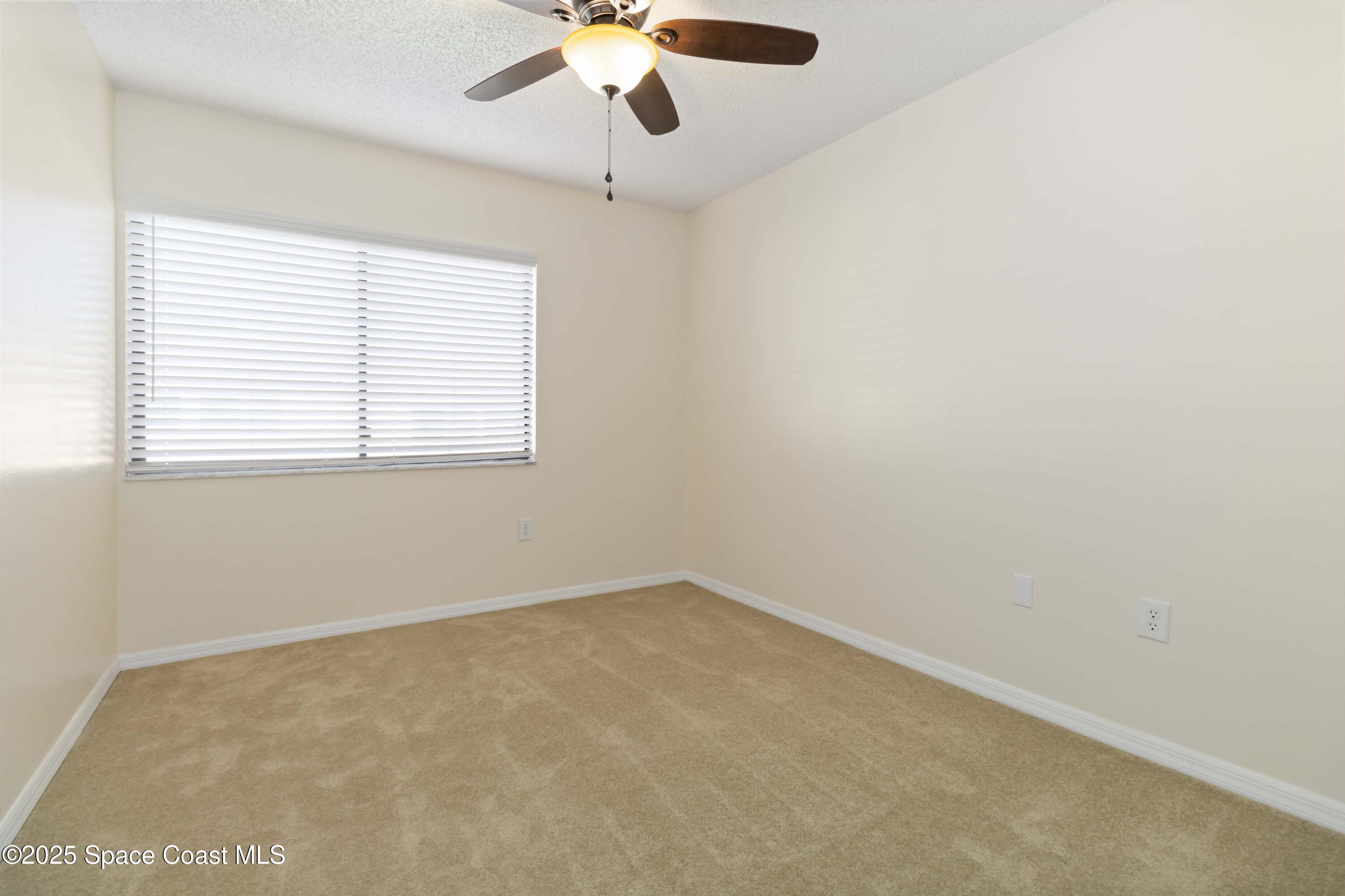 182 Bluefish Place, Unit 710 Rockledge, FL 32955 - Photo 18 of 33 an empty room with a window