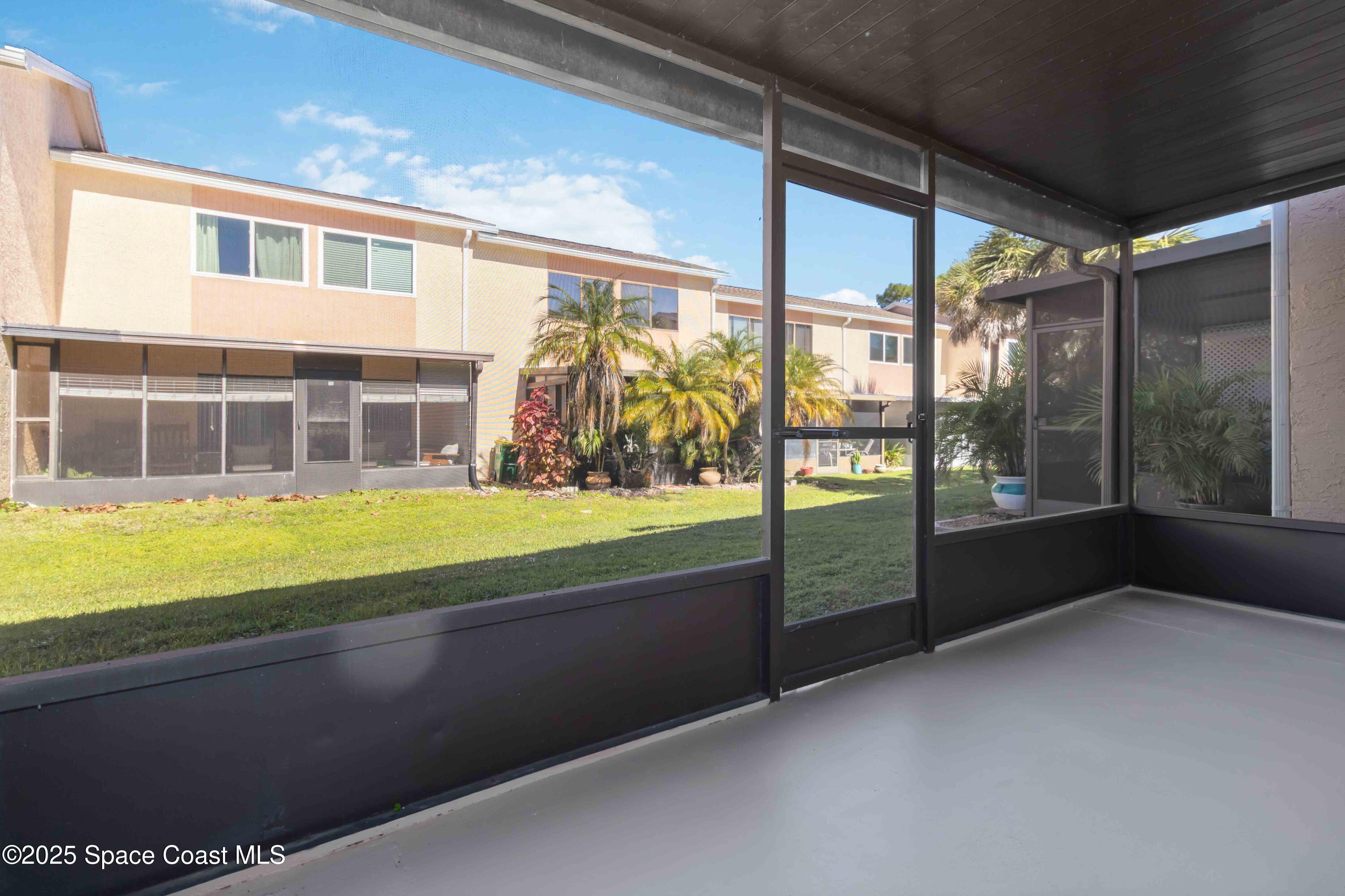 182 Bluefish Place, Unit 710 Rockledge, FL 32955 - Photo 26 of 33 a view of an empty room with wooden floor and a bathtub