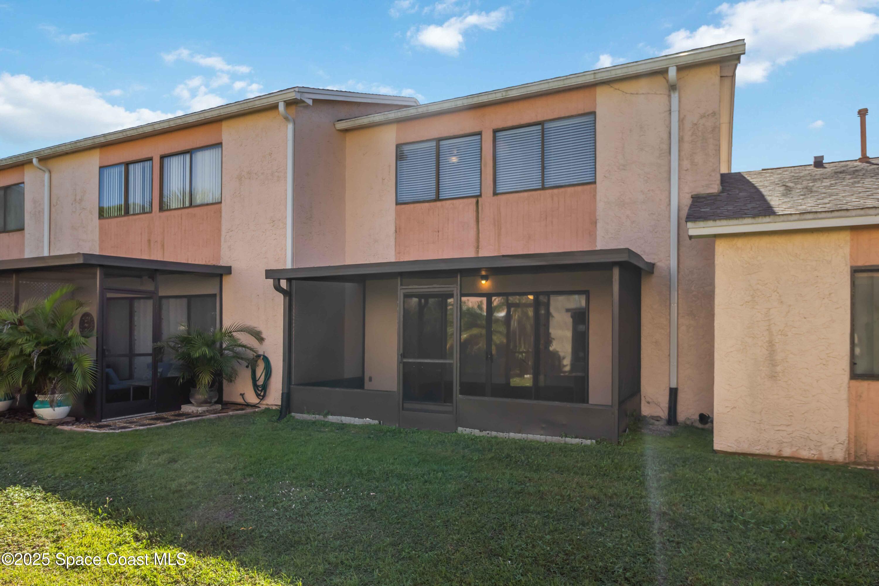 182 Bluefish Place, Unit 710 Rockledge, FL 32955 - Photo 29 of 33 a front view of a house with a yard