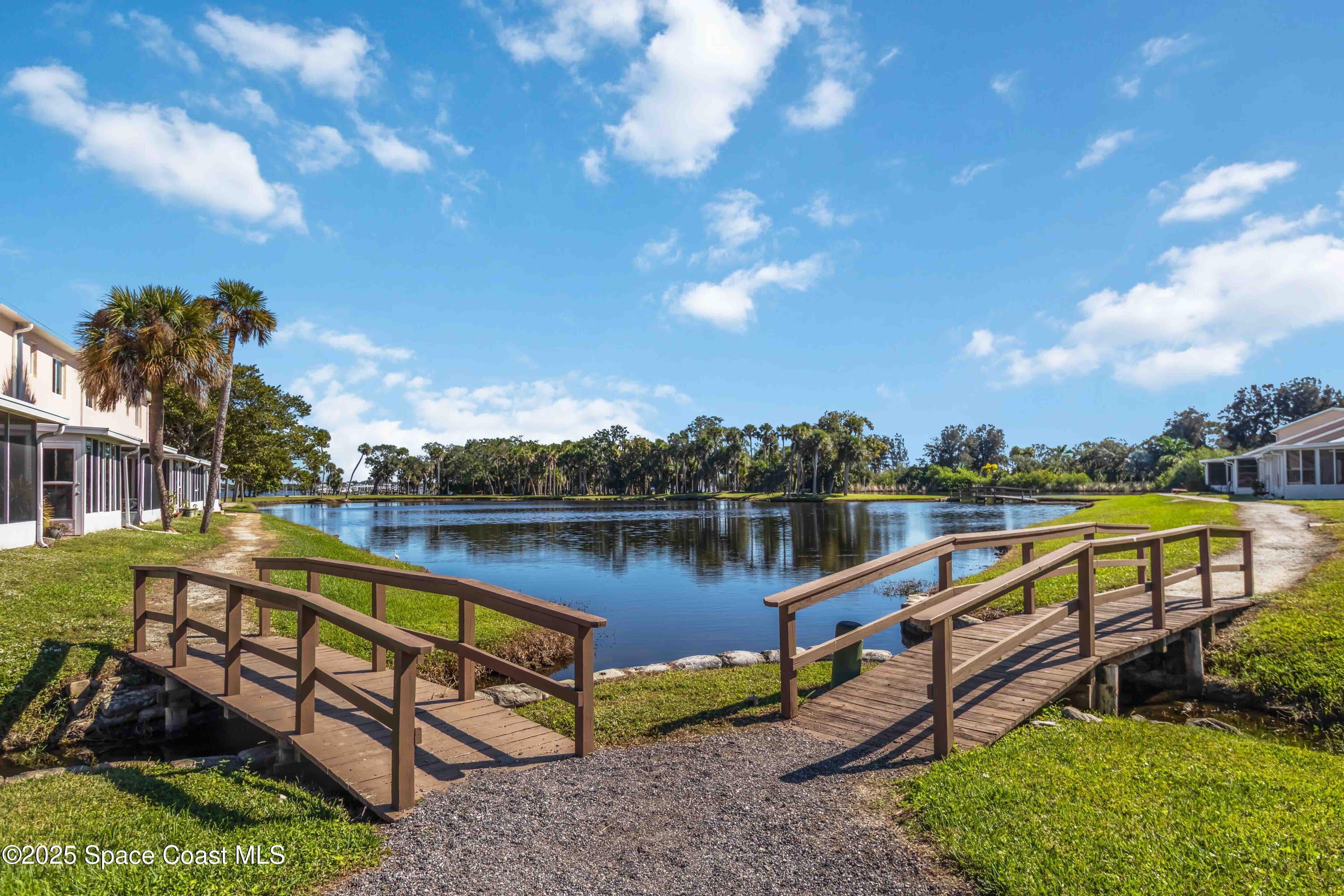 182 Bluefish Place, Unit 710 Rockledge, FL 32955 - Photo 32 of 33 a view of a lake with houses