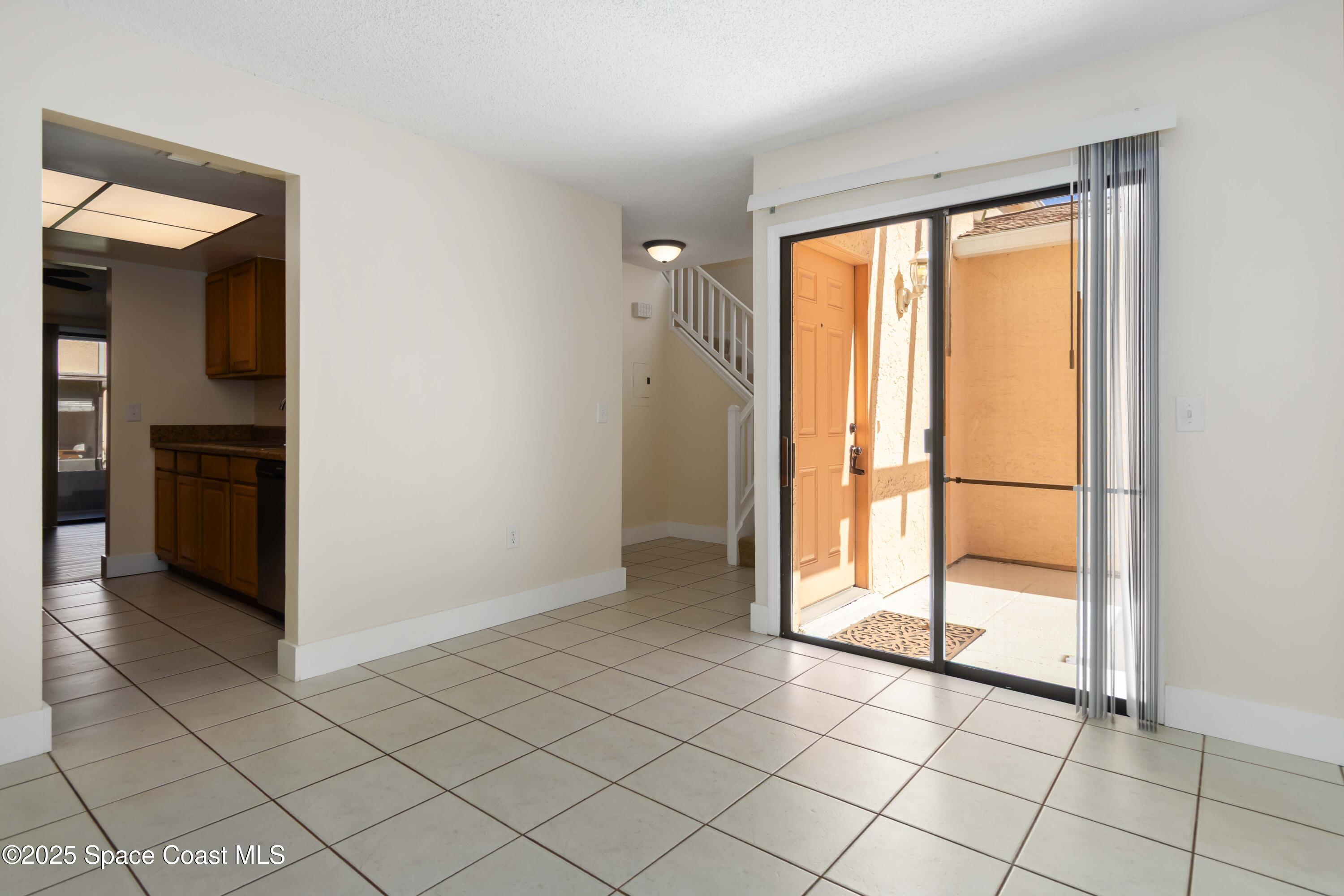 182 Bluefish Place, Unit 710 Rockledge, FL 32955 - Photo 6 of 33 a view of an empty room and window
