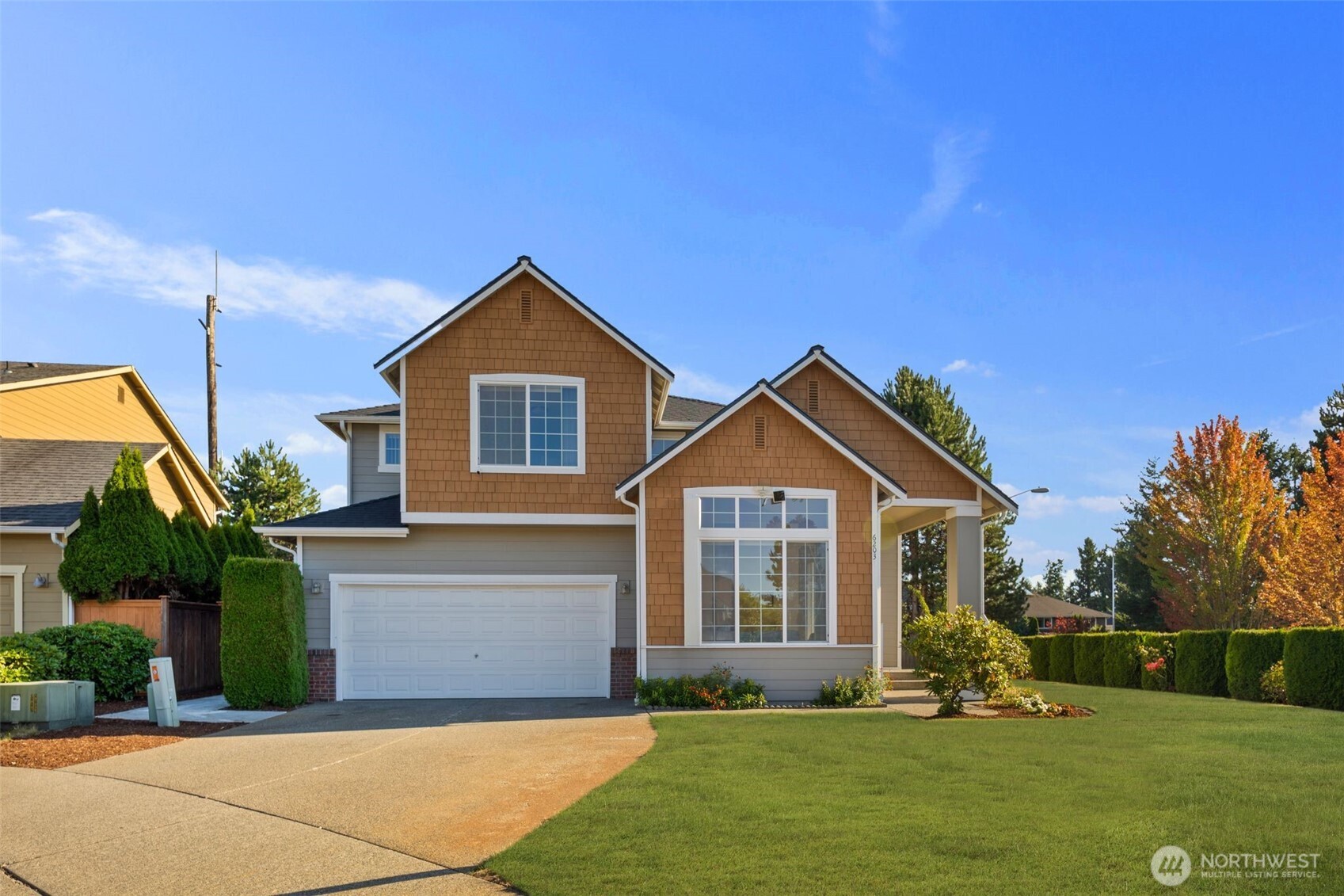 6203 Northeast 4th Circle Renton, WA 98059 - Photo 1 of 40 a front view of a house with garden
