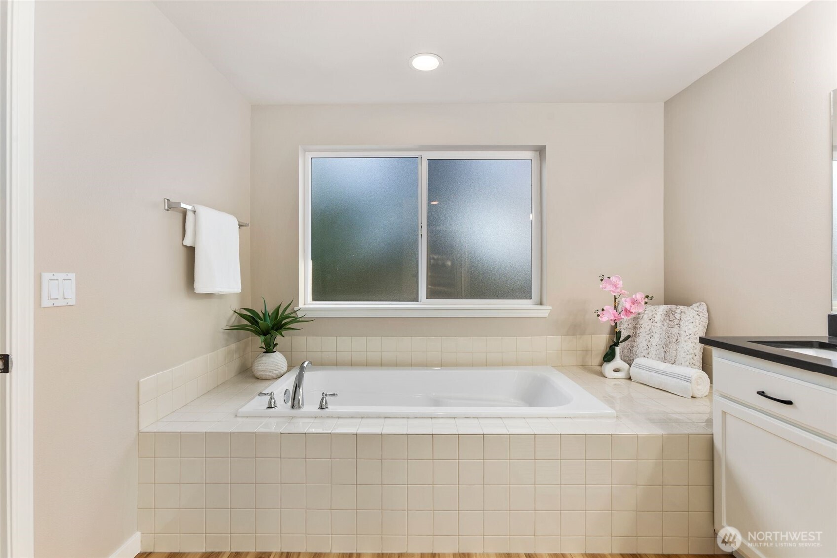 6203 Northeast 4th Circle Renton, WA 98059 - Photo 35 of 40 a bathroom with a bathtub and a sink
