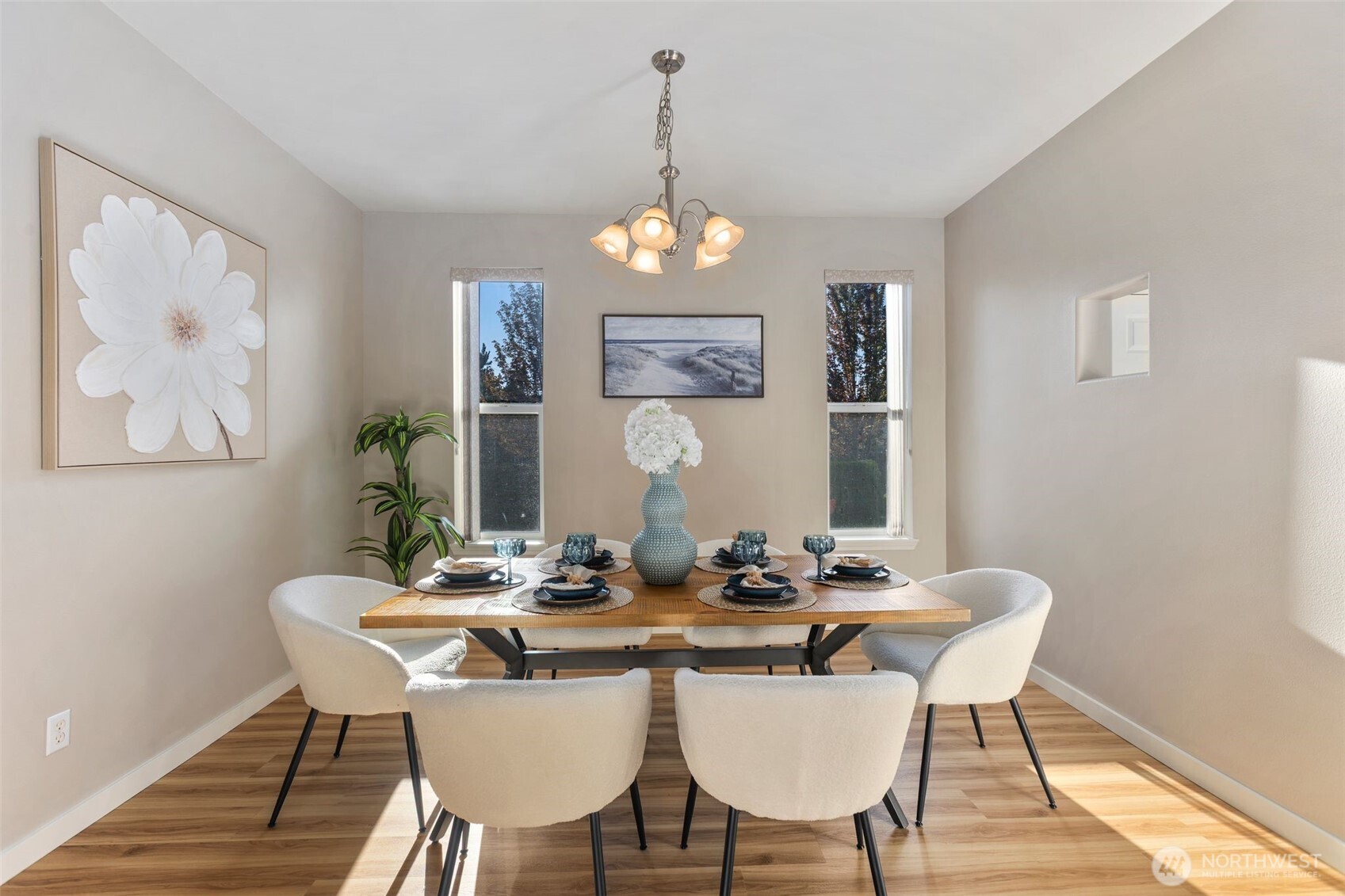 6203 Northeast 4th Circle Renton, WA 98059 - Photo 6 of 40 a view of a dining room with furniture wooden floor and chandelier