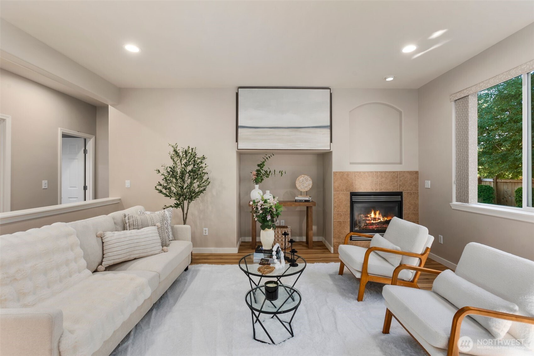 6203 Northeast 4th Circle Renton, WA 98059 - Photo 10 of 40 a living room with furniture potted plant and a fireplace