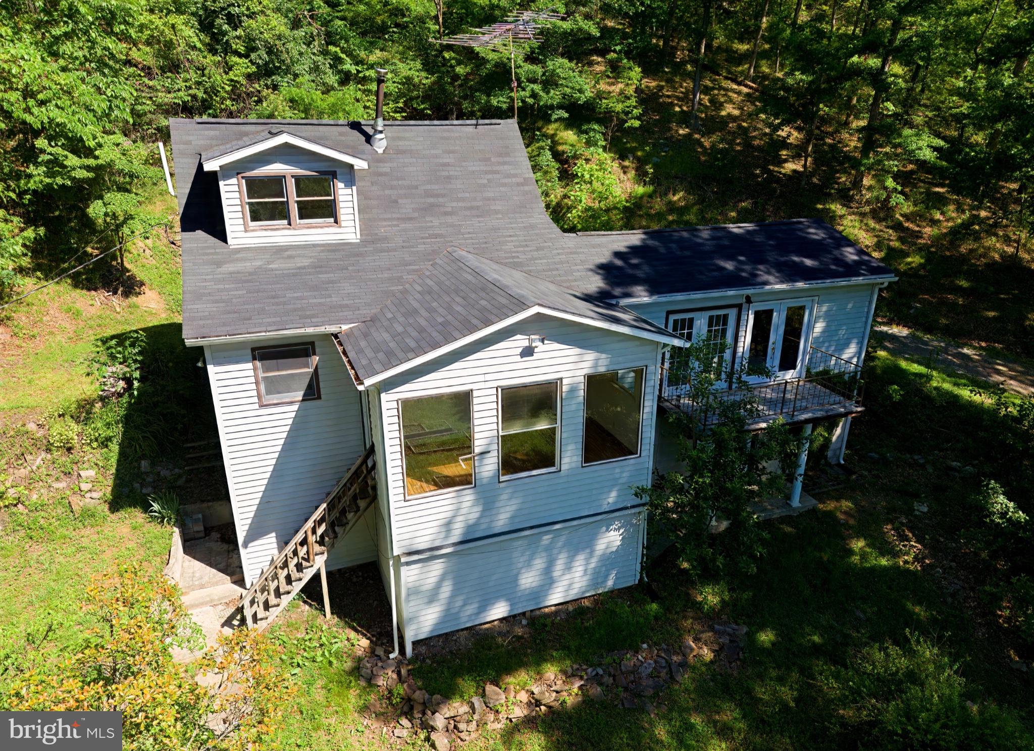 2932 Kerns School Road Springfield, WV 26763 - Photo 1 of 35 Charming home nestled in nature's embrace.