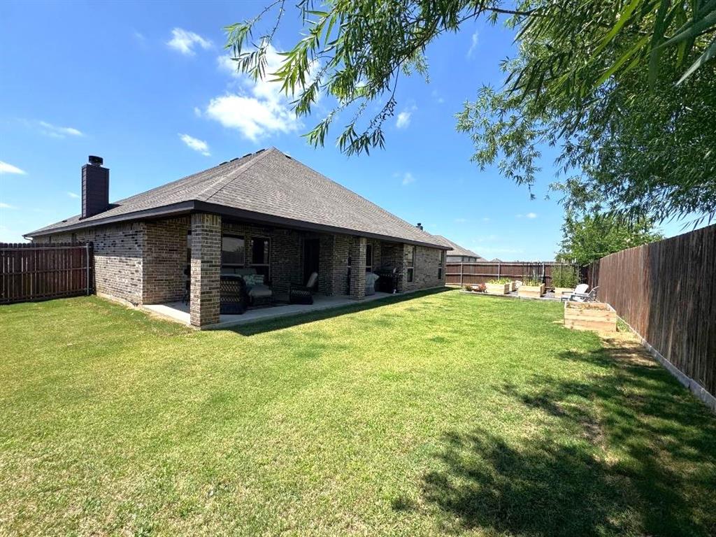 1455 Radecke Road Krum, TX 76249 - Photo 16 of 18 a front view of house with yard