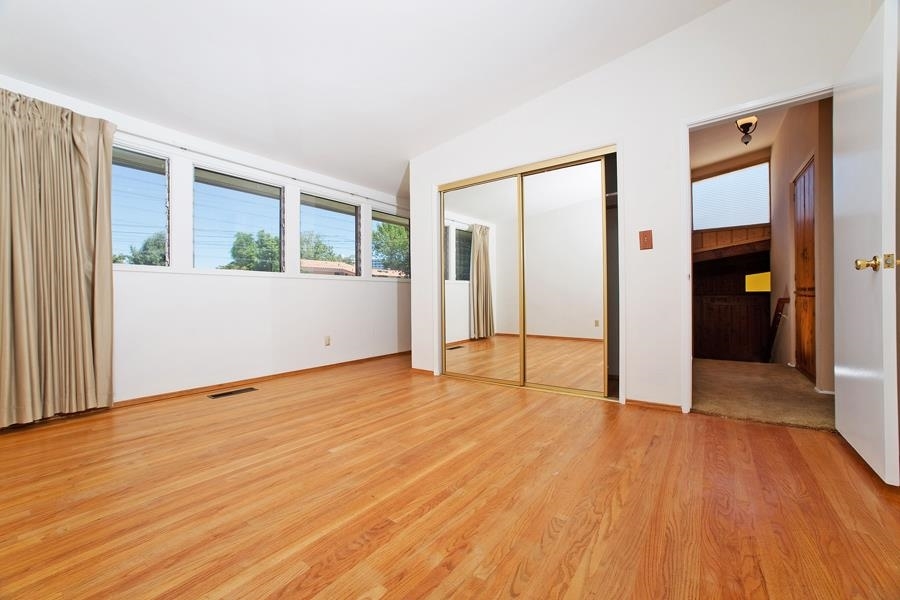 5440 Redding Road San Diego, CA 92115 - Photo 13 of 25 Removal of the carpet reveals warm hardwood floors.
