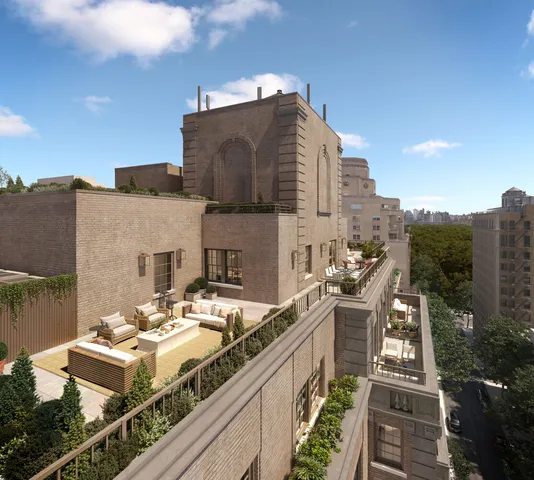 a balcony with a table and chairs