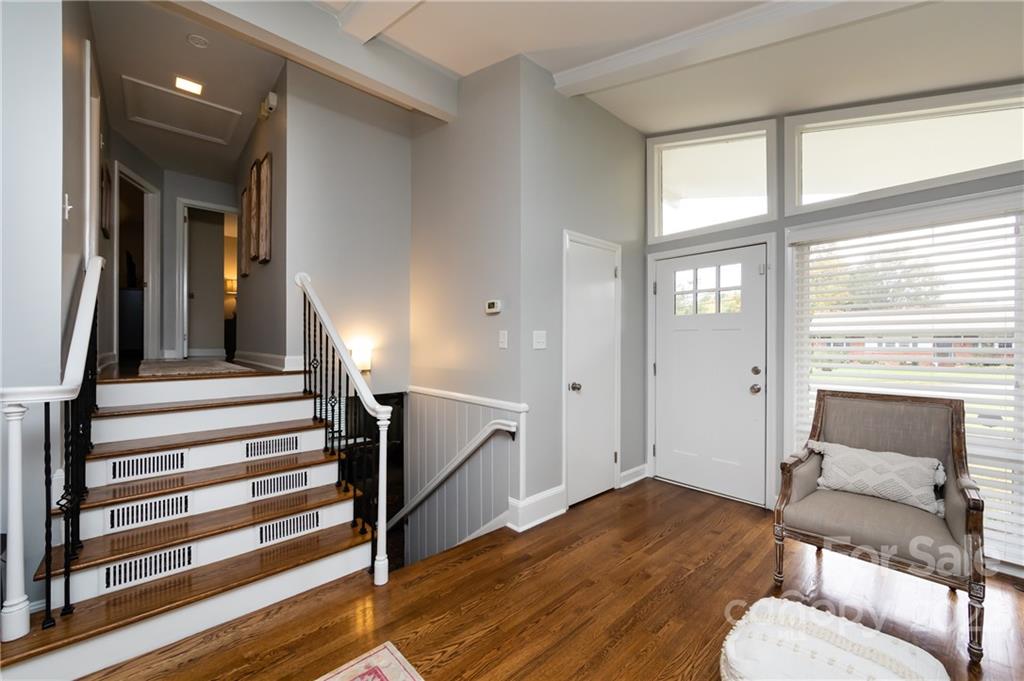 6409 Montpelier Road Charlotte, NC 28210 - Photo 3 of 35 a view of a livingroom with furniture and staircase with wooden floor