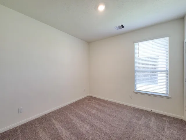 a view of a room with rack on the wall