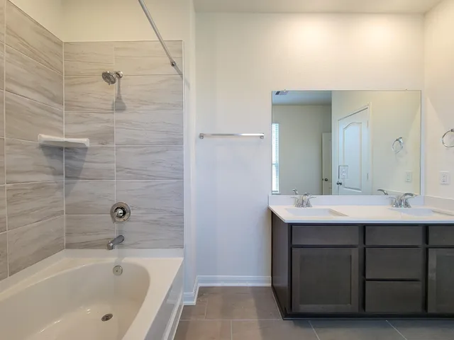a bathroom with a shower and a toilet