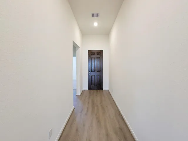 a view of kitchen with refrigerator microwave and stove