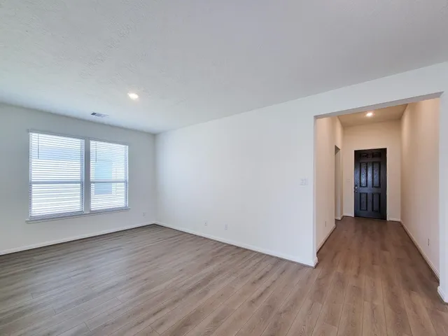 a view of kitchen with furniture and wooden floor