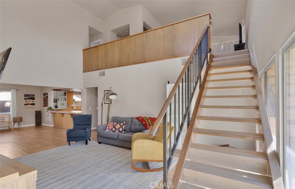 18199 Kalin Ranch Drive Victorville, CA 92395 - Photo 3 of 31 a living room with furniture and wooden floor