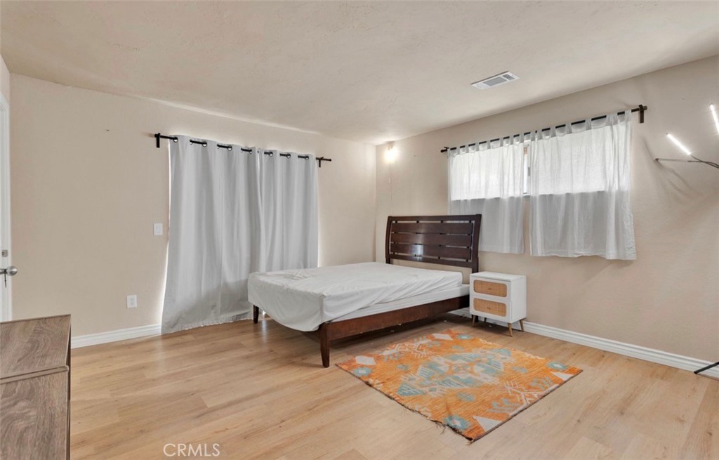 18199 Kalin Ranch Drive Victorville, CA 92395 - Photo 8 of 31 a living room with furniture and a flat screen tv