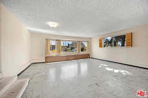 a view of an empty room with window