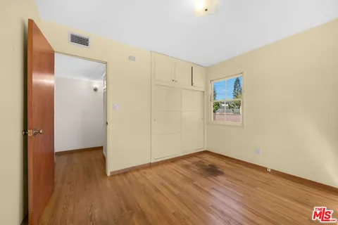 a bathroom with a tub a sink and a shower