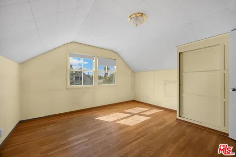 a bathroom with a sink mirror and toilet