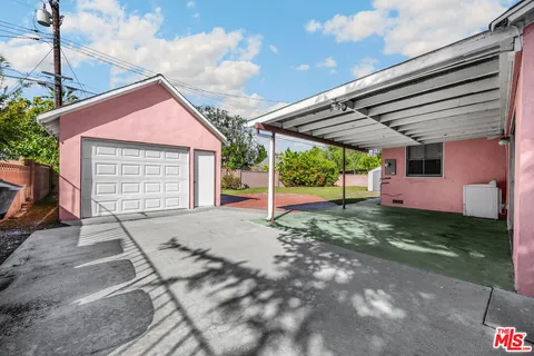 a kitchen with a stove a sink and a refrigerator