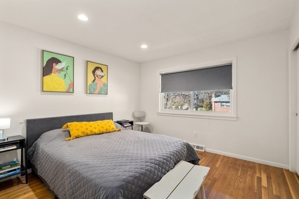 27 Grace Road Newton, MA 02459 - Photo 11 of 26 a bedroom with a bed and painting on the wall