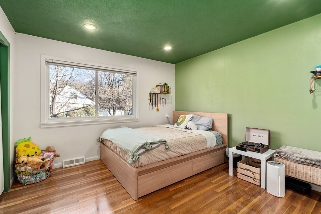 27 Grace Road Newton, MA 02459 - Photo 12 of 26 a spacious bedroom with a bed and a window