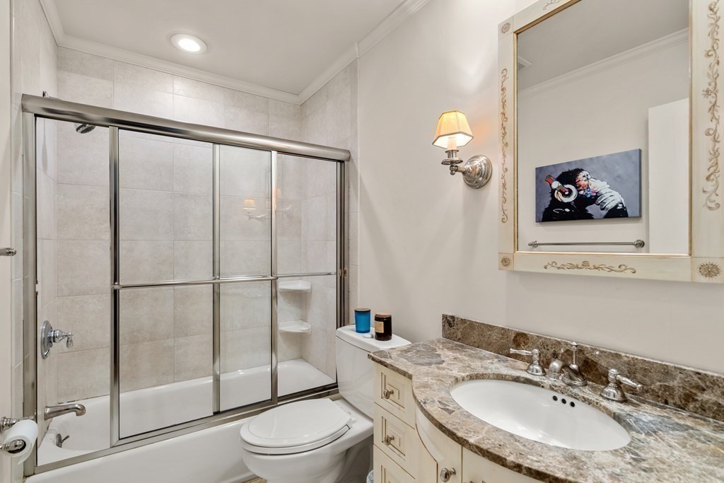 27 Grace Road Newton, MA 02459 - Photo 15 of 26 a bathroom with a sink toilet and shower