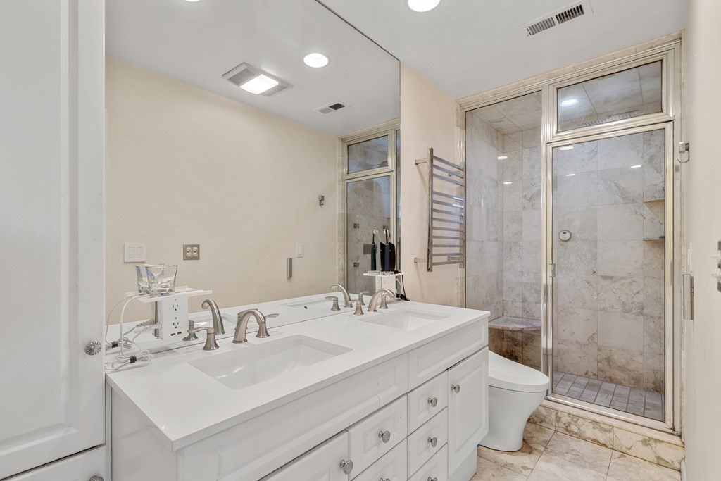 27 Grace Road Newton, MA 02459 - Photo 16 of 26 a bathroom with a sink shower and a mirror