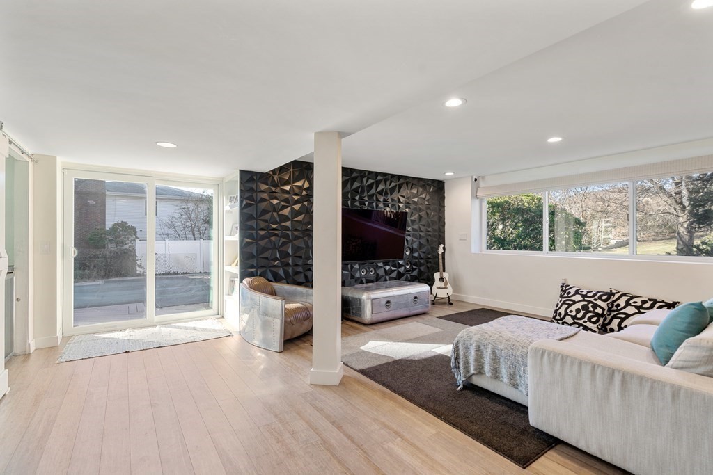 27 Grace Road Newton, MA 02459 - Photo 18 of 26 a spacious bedroom with a large bed and a flat screen tv