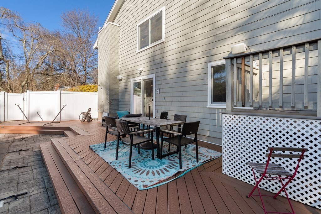 27 Grace Road Newton, MA 02459 - Photo 23 of 26 a view of a patio with a table and chairs
