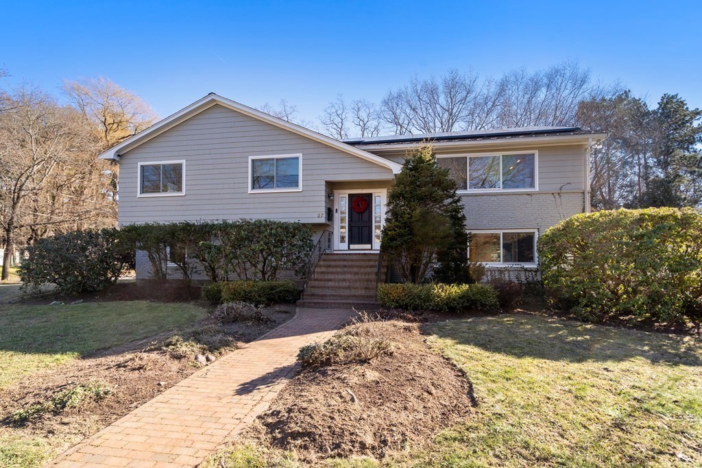 27 Grace Road Newton, MA 02459 - Photo 24 of 26 a front view of a house with garden