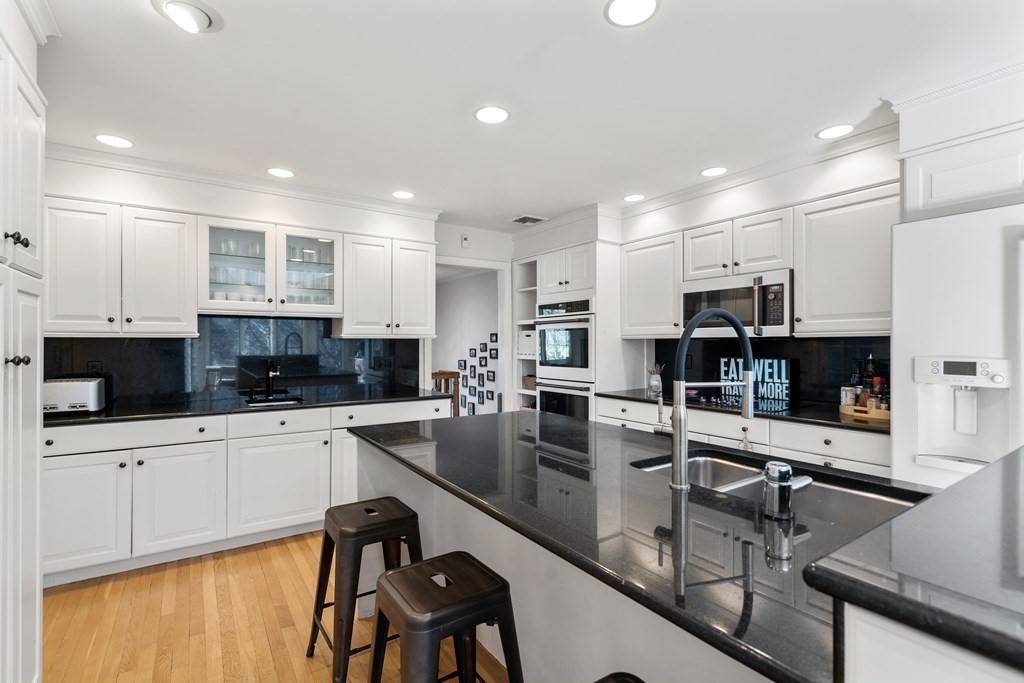 27 Grace Road Newton, MA 02459 - Photo 8 of 26 a kitchen with white cabinets sink and appliances