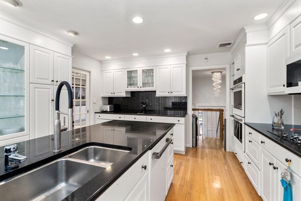 27 Grace Road Newton, MA 02459 - Photo 10 of 26 a kitchen with a sink stove and refrigerator