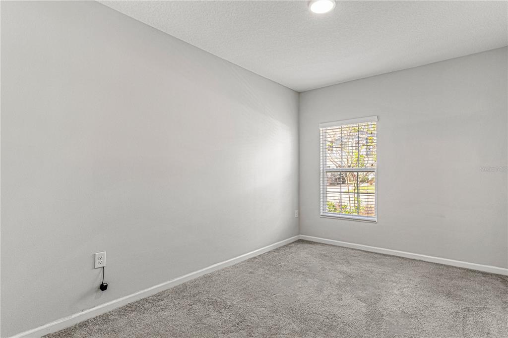 2875 Narcoossee Cmns Way St. Cloud, FL 34771 - Photo 12 of 50 an empty room with a window