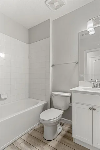a bathroom with a toilet a sink and a bathtub