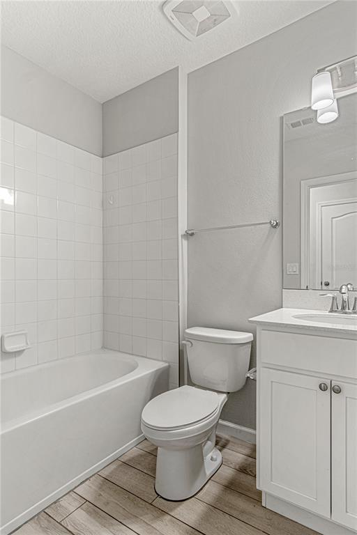 2875 Narcoossee Cmns Way St. Cloud, FL 34771 - Photo 15 of 50 a bathroom with a toilet a sink and a bathtub